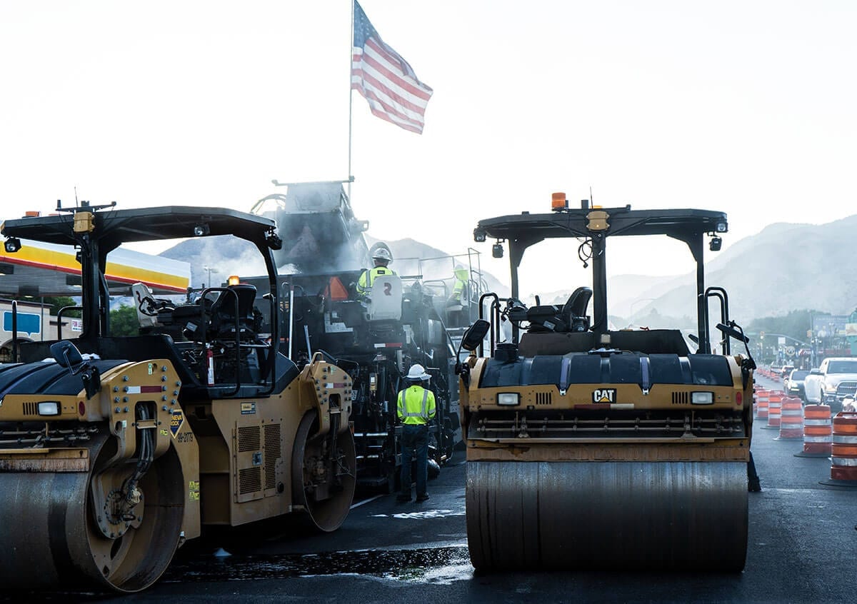 The American flag flys in the morning breeze as Geneva Rock prepares to pave roads in Logan, Utah