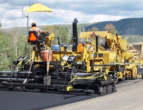 Asphalt paver putting down hot mix asphalt from Geneva Rock plant