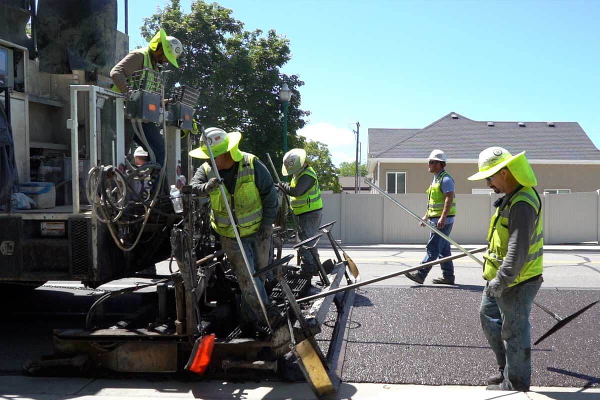Microsurfacing crew extending the life of the asphalt pavement